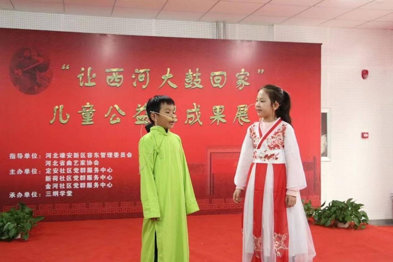 定安社区“让西河大鼓回家”儿童公益课成果展示暨二十大基层理论宣讲 高璐摄